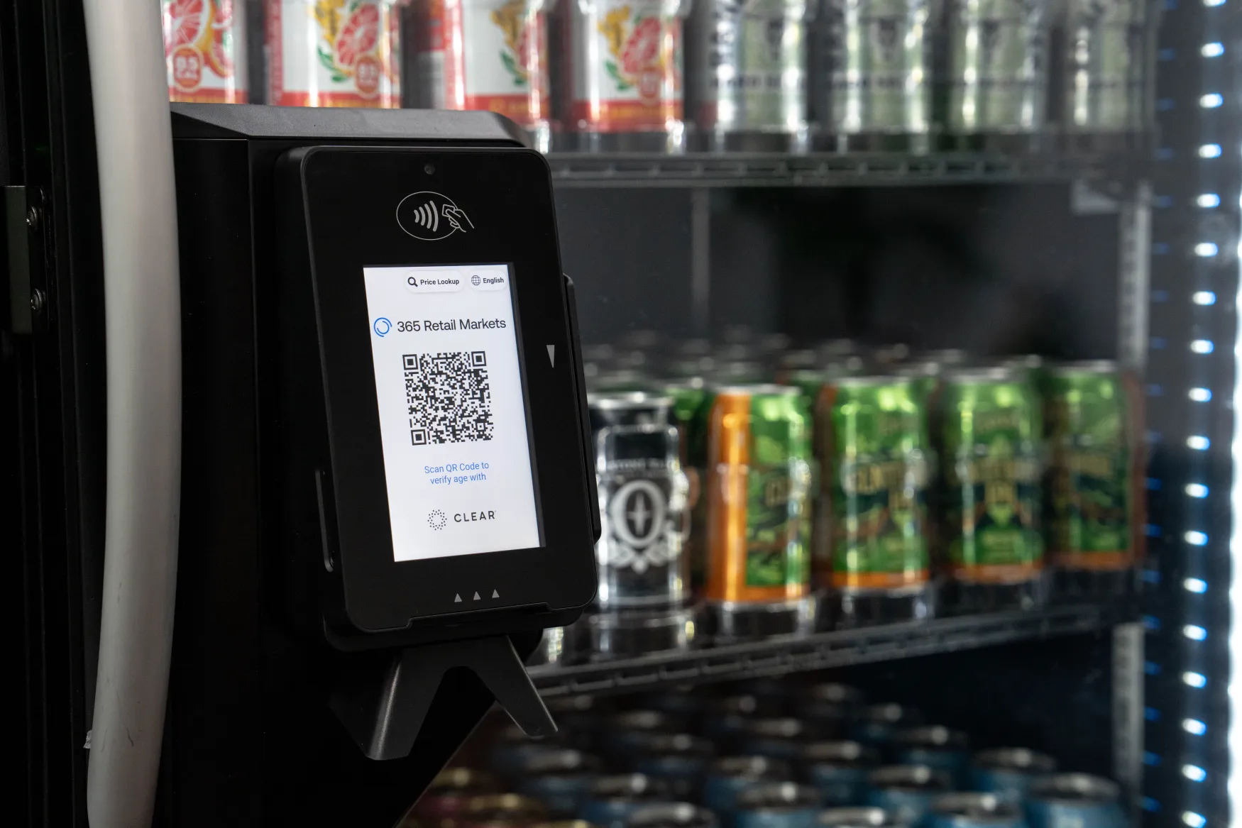 Cooler showing a payment device enabling age verification feature, allowing sale of alcoholic beverages