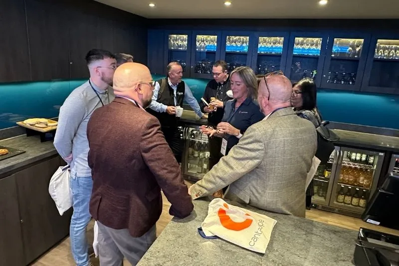 A small group chats at the user conference party.